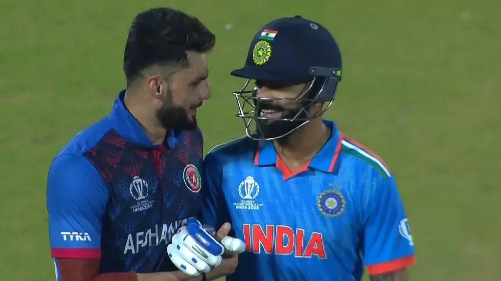 Virat Kohli and Naveen Shake hands